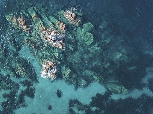 abstract ariel view of rocks in water